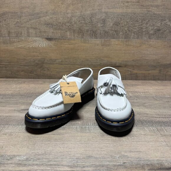 The Dr. Martens Adrian White Leather Tassel Loafers are stylish and versatile wo